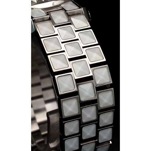 116 - A Christian Dior 'Christal' Diamond Quartz Ladies Watch. Stainless steel and white crystal bracelet.... 