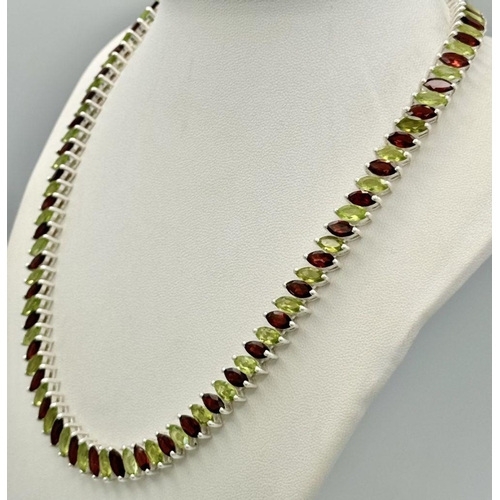 128 - A Marquise Cut Peridot and Garnet Gemstone Tennis Necklace. Set in 925 Silver. 44cm. CD-1612