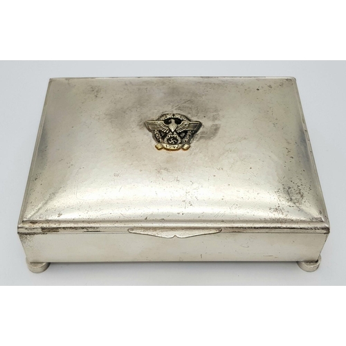 369 - A WW2 German Silver Plated Cigarette Box with a 1942 Police Badge.