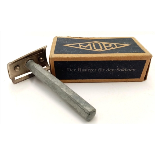 376 - A WW2 German Razor, spare blades and soap.