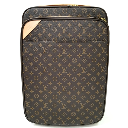 1227 - A Louis Vuitton Monogram Pegase Suitcase. Durable leather exterior with gold-toned hardware. Front c... 