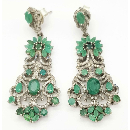 2075 - A pair 925 silver Emerald and Diamond Dangler Earrings. 12.1cts of emeralds and 2.65cts of diamonds.... 