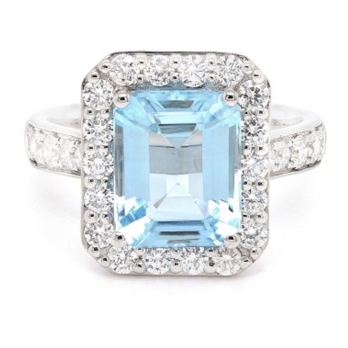 393 - A Platinum Cluster Ring, featuring a 2.95ct Emerald-Cut Aquamarine surrounded by a halo of Round Bri... 