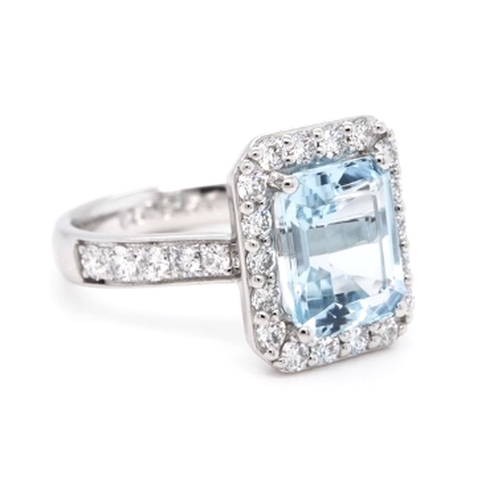 393 - A Platinum Cluster Ring, featuring a 2.95ct Emerald-Cut Aquamarine surrounded by a halo of Round Bri... 