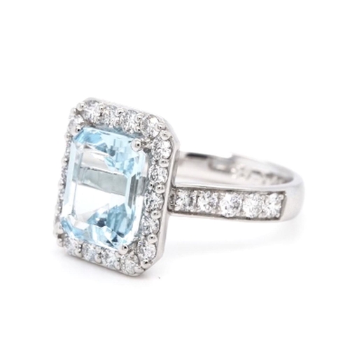 393 - A Platinum Cluster Ring, featuring a 2.95ct Emerald-Cut Aquamarine surrounded by a halo of Round Bri... 