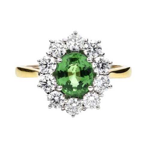 421 - An 18K Yellow & White Gold Cluster Ring, featuring a 1.30ct Oval Tsavorite surrounded by a halo of R... 