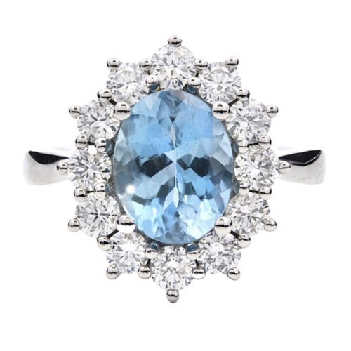 435 - A Platinum Cluster Ring, featuring a 1.81ct Oval Aquamarine surrounded by a halo of Round Brilliant-... 