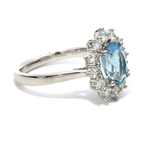 435 - A Platinum Cluster Ring, featuring a 1.81ct Oval Aquamarine surrounded by a halo of Round Brilliant-... 