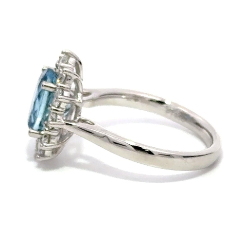 435 - A Platinum Cluster Ring, featuring a 1.81ct Oval Aquamarine surrounded by a halo of Round Brilliant-... 