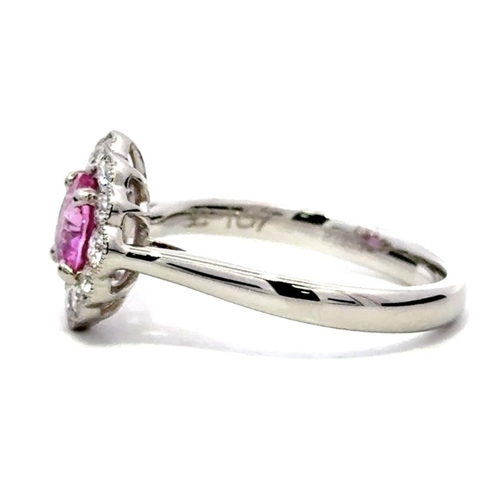 715 - A Platinum Cluster Ring, featuring a 1.07ct Oval Pink Sapphire surrounded by a halo of Round Brillia... 