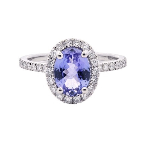 729 - A Platinum Cluster Ring, featuring a 1.15ct Oval Tanzanite surrounded by a halo of Round Brilliant-C... 