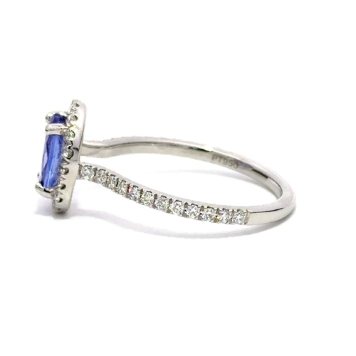 729 - A Platinum Cluster Ring, featuring a 1.15ct Oval Tanzanite surrounded by a halo of Round Brilliant-C... 