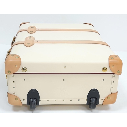 100 - A Globe-Trotter Beigh Plastic Suitcase. Plastic exterior with leather accents and gold-toned hardwar... 