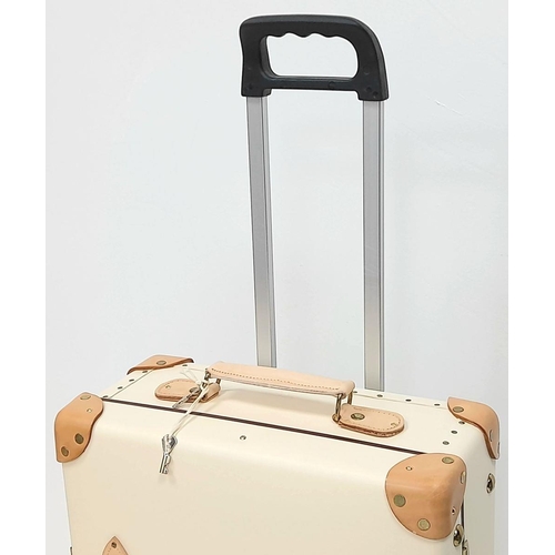 100 - A Globe-Trotter Beigh Plastic Suitcase. Plastic exterior with leather accents and gold-toned hardwar... 