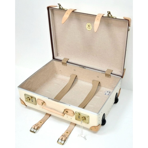 100 - A Globe-Trotter Beigh Plastic Suitcase. Plastic exterior with leather accents and gold-toned hardwar... 