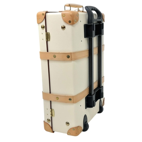 100 - A Globe-Trotter Beigh Plastic Suitcase. Plastic exterior with leather accents and gold-toned hardwar... 