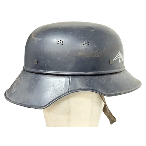 285 - A WW2 German “Gladiator” Civil Defence Helmet from the Heinkel Aircraft Works. Complete with liner &... 