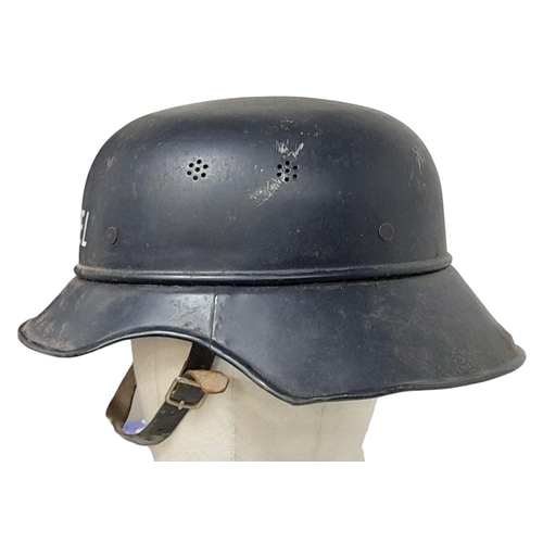 285 - A WW2 German “Gladiator” Civil Defence Helmet from the Heinkel Aircraft Works. Complete with liner &... 