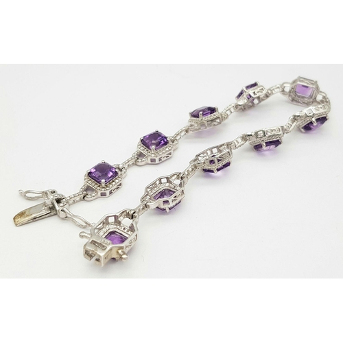 694 - A Sterling Silver Cushion Cut, Top Colour, Amethyst Tennis Bracelet. 21cm Length. Gross Weight 18.96... 