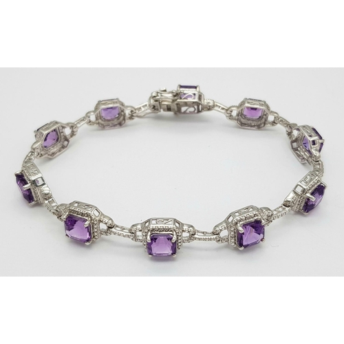 694 - A Sterling Silver Cushion Cut, Top Colour, Amethyst Tennis Bracelet. 21cm Length. Gross Weight 18.96... 