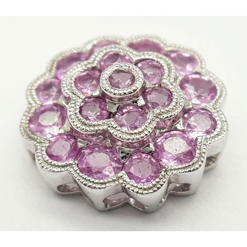 867 - A 9K WHITE GOLD PINK SAPPHIRE SET FLOWER PENDANT 1.8G TOTAL WEIGHT. Ref: SC 7010