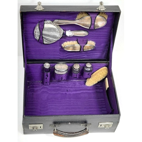 93 - A GENUINE ANTIQUE TRAVEL CASE FROM THE TURN OF THE CENTURY WITH HALLMARKED SILVER BOTTLE TOPS AND BR... 