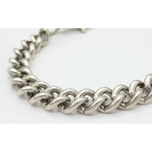 297 - A 925 Silver Curb Link Bracelet. 24.5cm length, 48g weight.