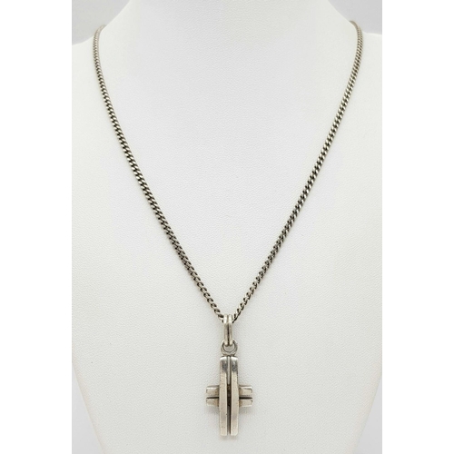 550 - A 925 Silver Cross Pendant on Chain. 3.8cm pendant, 56cm chain. 18.14g total weight.