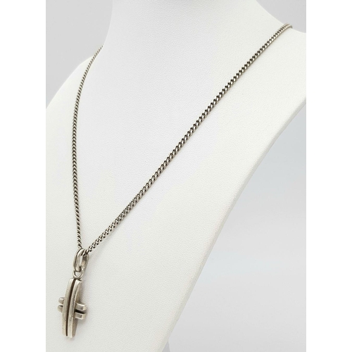 550 - A 925 Silver Cross Pendant on Chain. 3.8cm pendant, 56cm chain. 18.14g total weight.