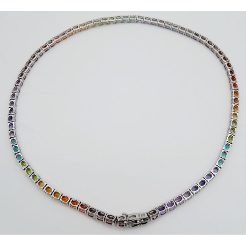 598 - A Stunning Sterling Silver Multi Gemstone Set Necklace-46cm Length. Set with Eight-Two 5mm Oval Cut ... 