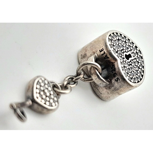 993 - A PANDORA STERLING SILVER STONE SET HEART & KEY CHARM 4.2G TOTAL WEIGHT. Ref: SC 7110