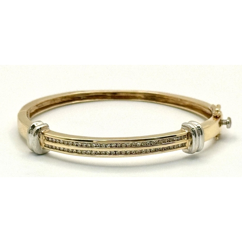 121 - A Stylish 9K Yellow and White Gold, Diamond Bangle. 62 small round cut diamonds over two levels. Cli... 