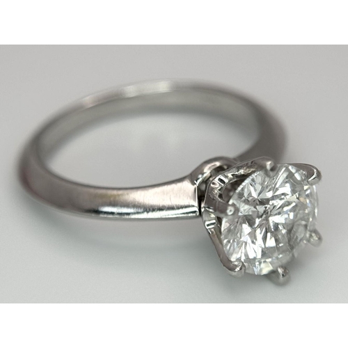 13 - A PLATINUM NATURAL DIAMOND SOLITAIRE RING. APPROX 2.10CT ROUND BRILIANT CUT. 6.4G, SIZE N. DIAMOND H... 