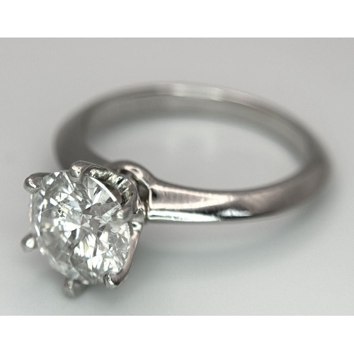 13 - A PLATINUM NATURAL DIAMOND SOLITAIRE RING. APPROX 2.10CT ROUND BRILIANT CUT. 6.4G, SIZE N. DIAMOND H... 