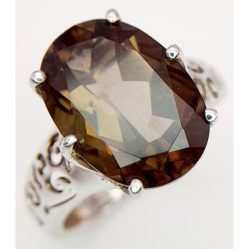 140 - Impressive 3 CARAT BROWN AMETHYST Oval Cut and mounted in a 925 SILVER RING. Having beautiful scroll... 