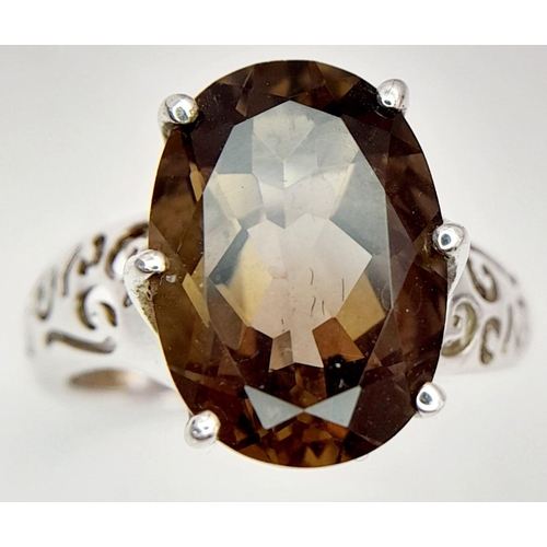 140 - Impressive 3 CARAT BROWN AMETHYST Oval Cut and mounted in a 925 SILVER RING. Having beautiful scroll... 