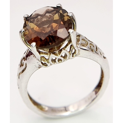 140 - Impressive 3 CARAT BROWN AMETHYST Oval Cut and mounted in a 925 SILVER RING. Having beautiful scroll... 