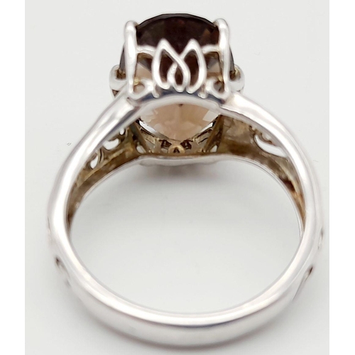 140 - Impressive 3 CARAT BROWN AMETHYST Oval Cut and mounted in a 925 SILVER RING. Having beautiful scroll... 