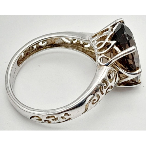 140 - Impressive 3 CARAT BROWN AMETHYST Oval Cut and mounted in a 925 SILVER RING. Having beautiful scroll... 