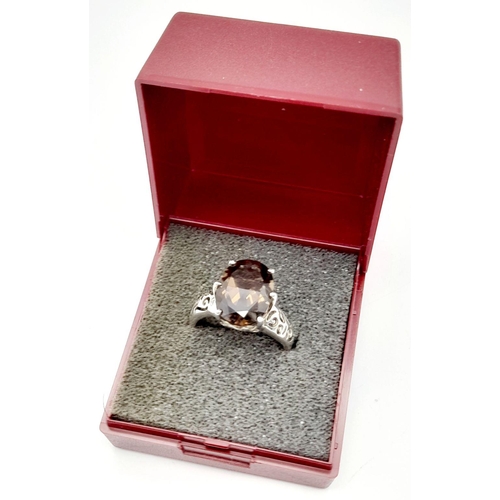 140 - Impressive 3 CARAT BROWN AMETHYST Oval Cut and mounted in a 925 SILVER RING. Having beautiful scroll... 