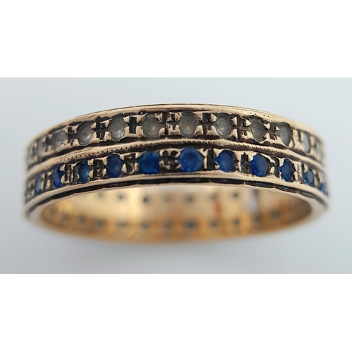 168 - Attractive and unusual 9 carat GOLD, DOUBLE ROW RING. Having a line of blue gemstones set alongside ... 