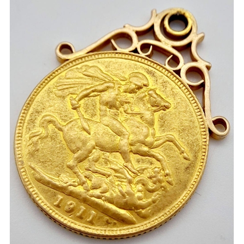 2 - A 22K GOLD FULL SOVEREIGN DATED 1911 WITH 9K GOLD SETTING , TOTAL WEIGHT 9.1gms