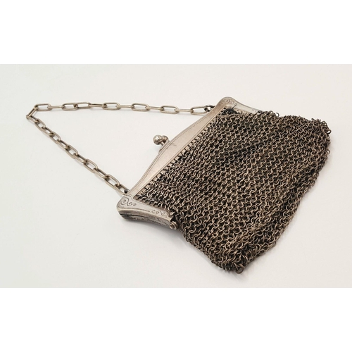 245 - Vintage SILVER MESH EVENING BAG/PURSE . Silk lined with silver plated fittings. Some signs of wear.a... 