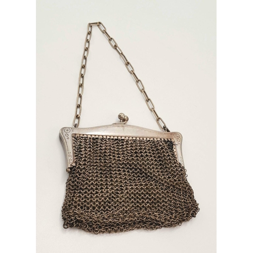 245 - Vintage SILVER MESH EVENING BAG/PURSE . Silk lined with silver plated fittings. Some signs of wear.a... 