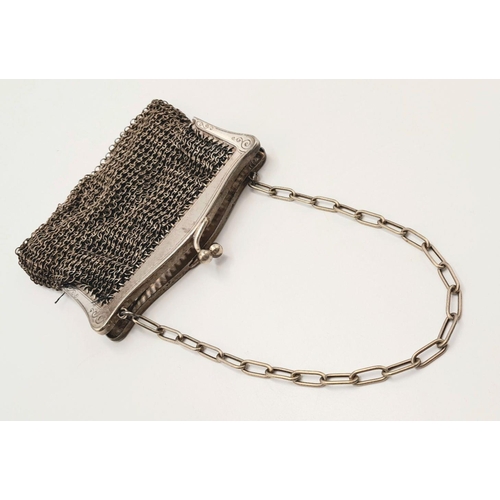 245 - Vintage SILVER MESH EVENING BAG/PURSE . Silk lined with silver plated fittings. Some signs of wear.a... 