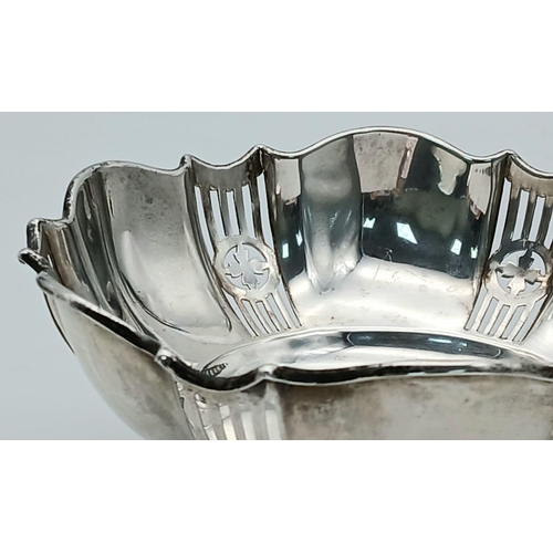 259 - Beautiful large antique SILVER BON BON DISH. Pierced decoration with serpentine rim. Standing on thr... 