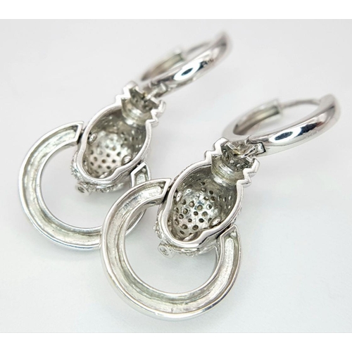 27 - A PAIR OF 14K WHITE GOLD DIAMOND SET PANTHER DROP EARRINGS. 10.5G TOTAL WEIGHT, 3.5cm LENGTH. Ref: T... 