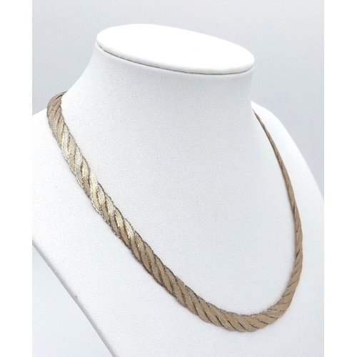 35 - Stunning 9 CARAT WHITE & YELLOW GOLD NECKLACE. Flat links skilfully entwined to create a beautiful s... 