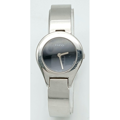 364 - Ladies genuine GUCCI 6700L WRISTWATCH. Finished in stainless steel chrome .Having Circular black fac... 