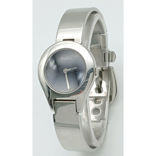 364 - Ladies genuine GUCCI 6700L WRISTWATCH. Finished in stainless steel chrome .Having Circular black fac... 